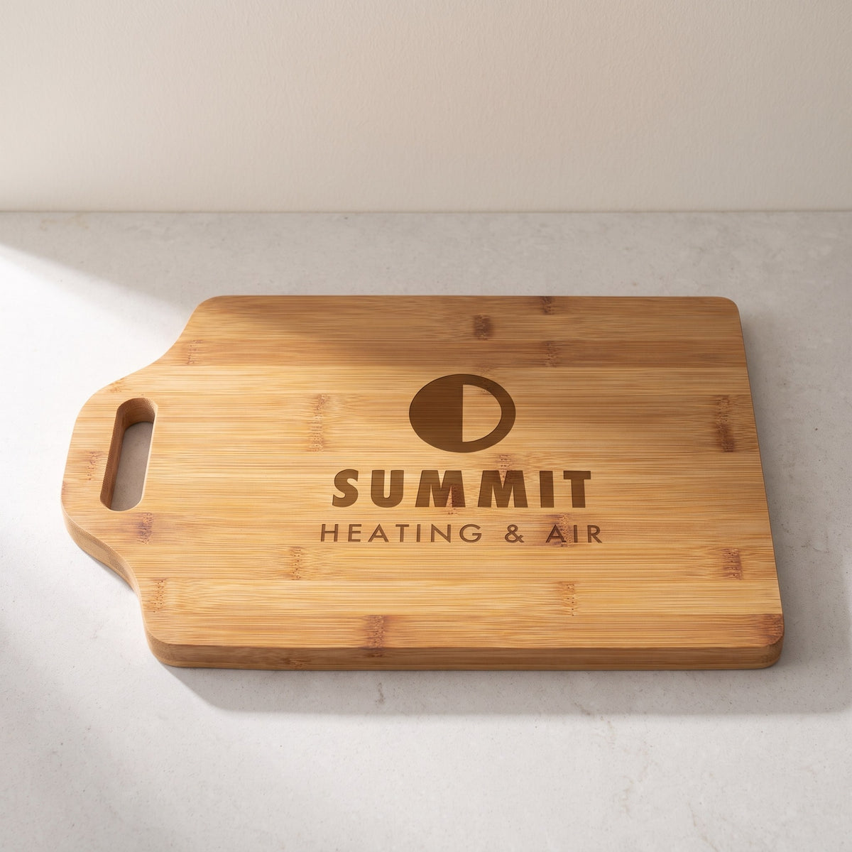 Custom Logo Bamboo Cutting Boards with Handle – 15" x 10¼" with sample engraved logo
