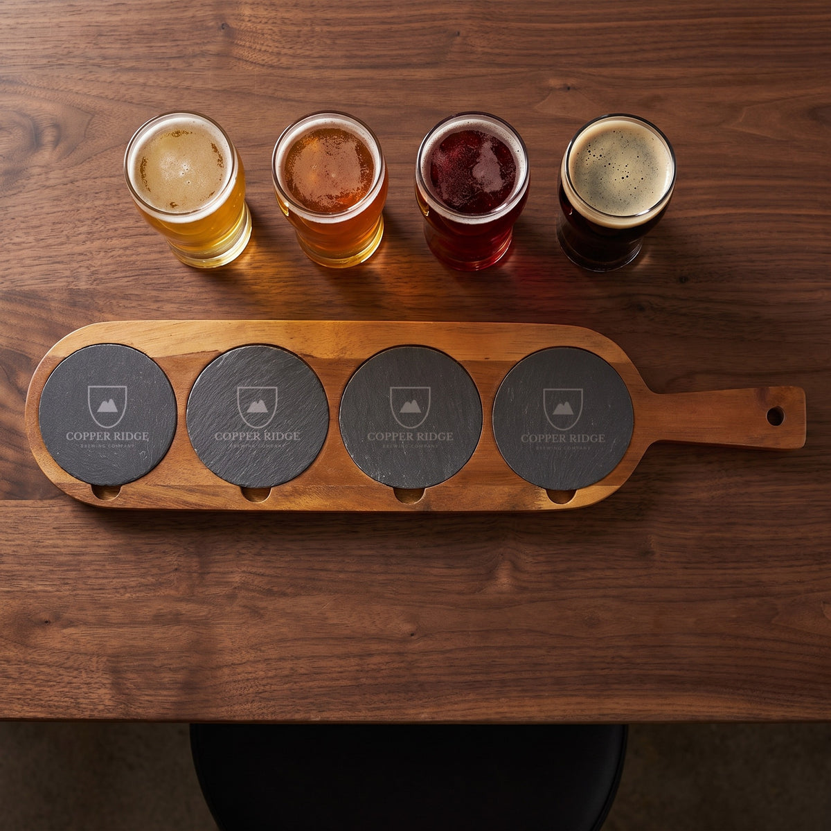 Custom Logo Slate & Acacia Serving Board, beer flight board with 4 slate coasters engraved with a sample brewery logo and a flight of beers