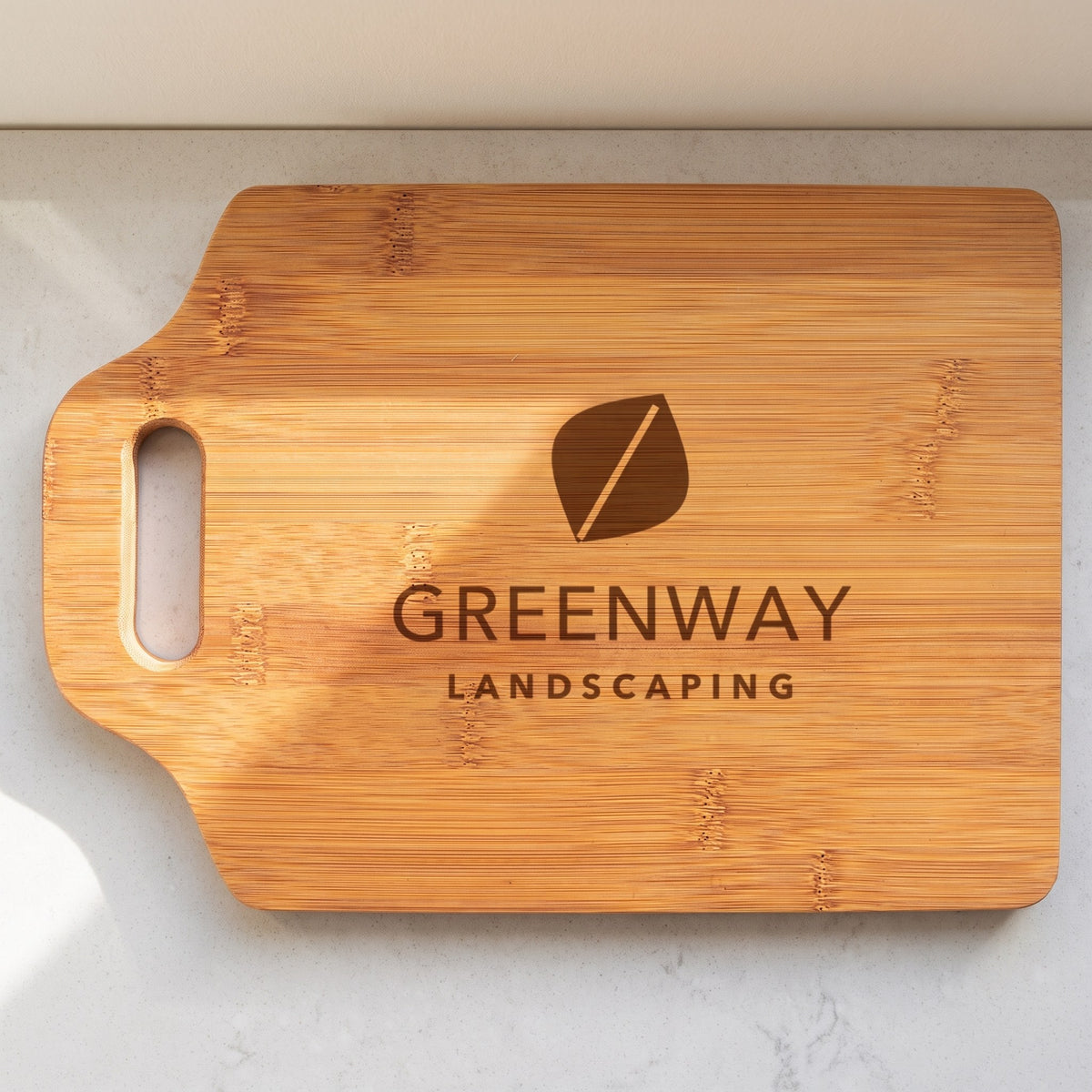 Custom Logo Bamboo Cutting Boards with Handle – 11" x 7¾" with sample engraved logo