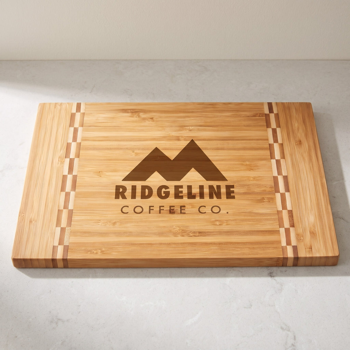 Custom Logo Bamboo Cutting Boards with Butcher Block Inlay – 12" x 8¼" with sample engraved logo