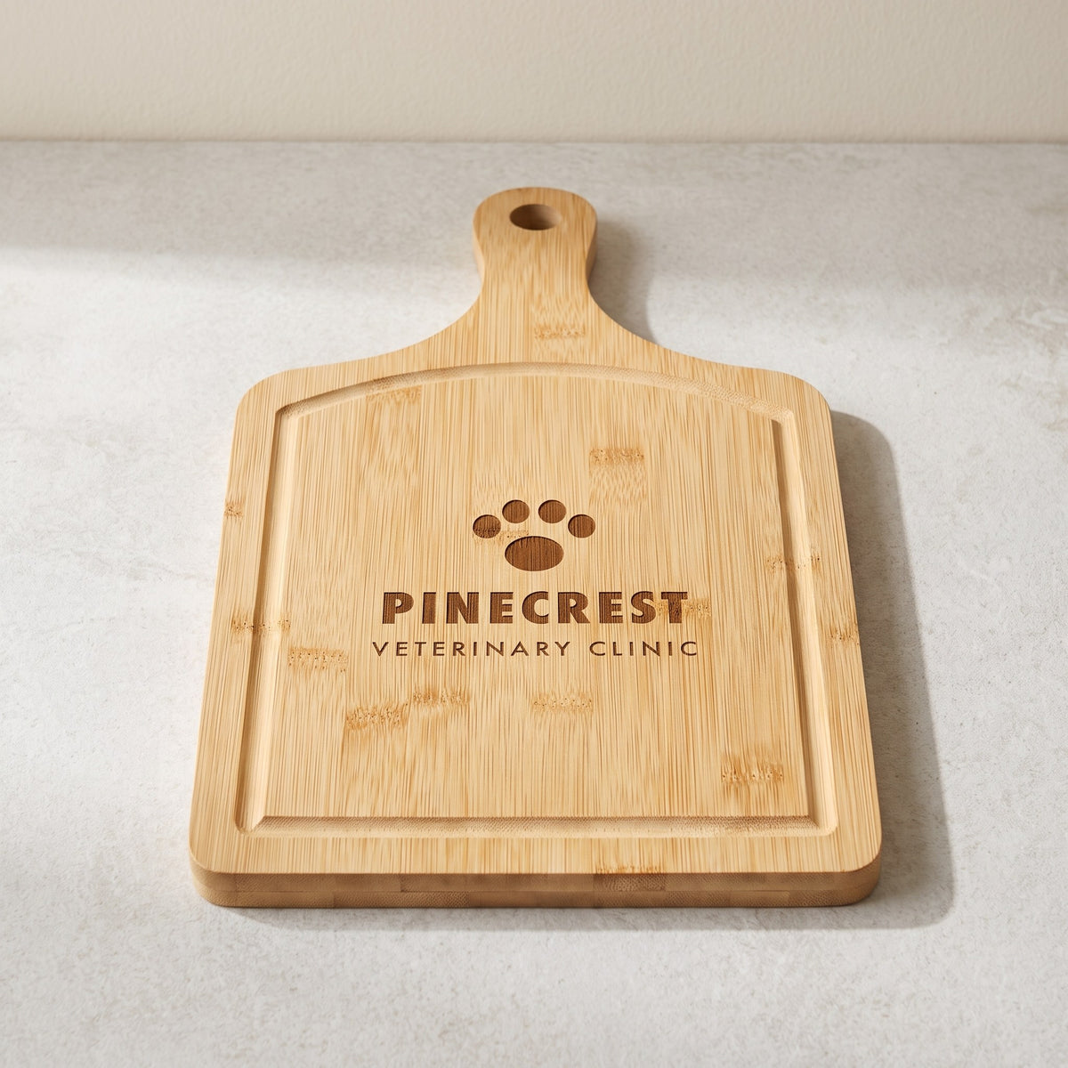 Custom Logo Bamboo Paddle Cutting Board with Drip Ring with sample engraved logo