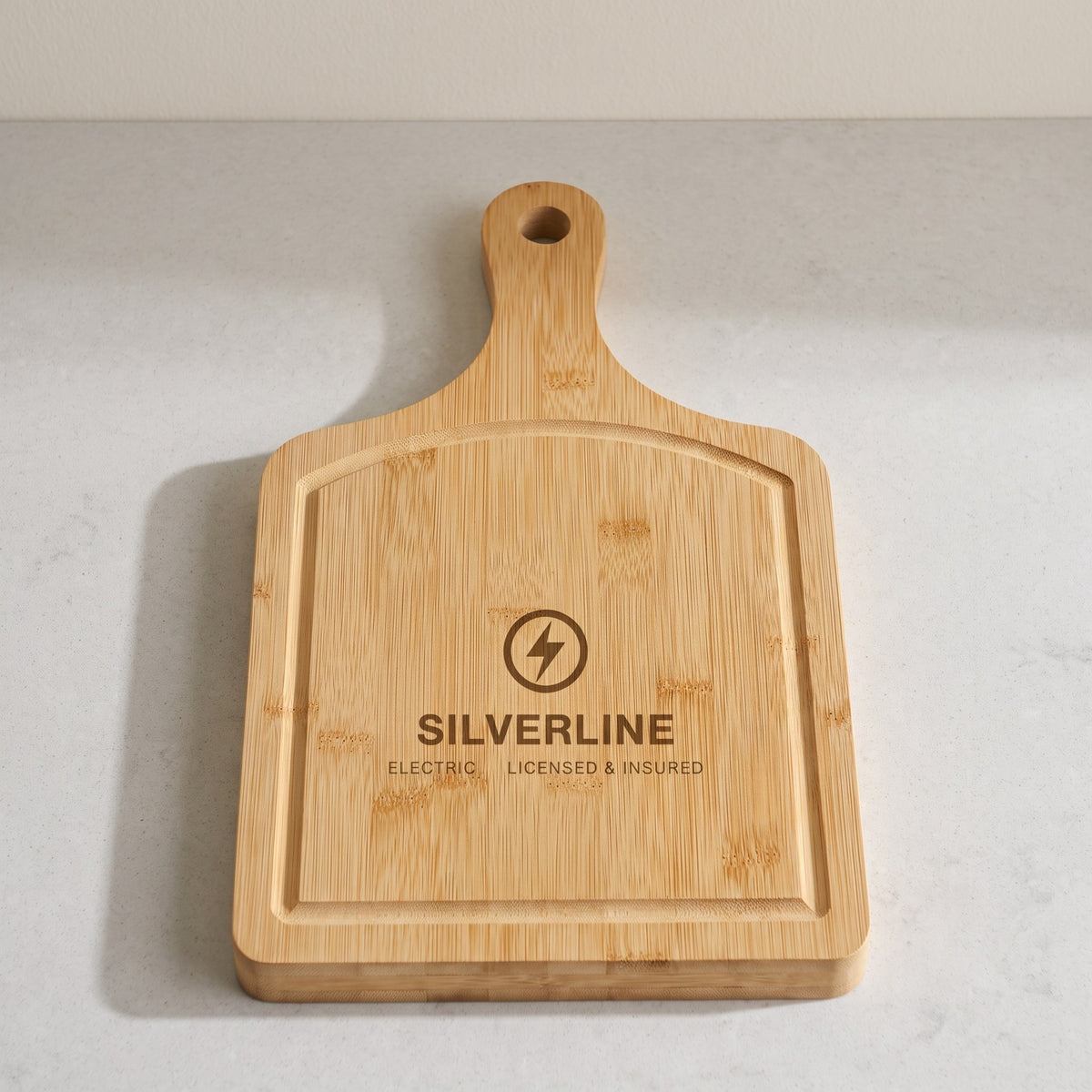 Custom Logo Bamboo Paddle Cutting Board with Drip Ring with sample engraved logo