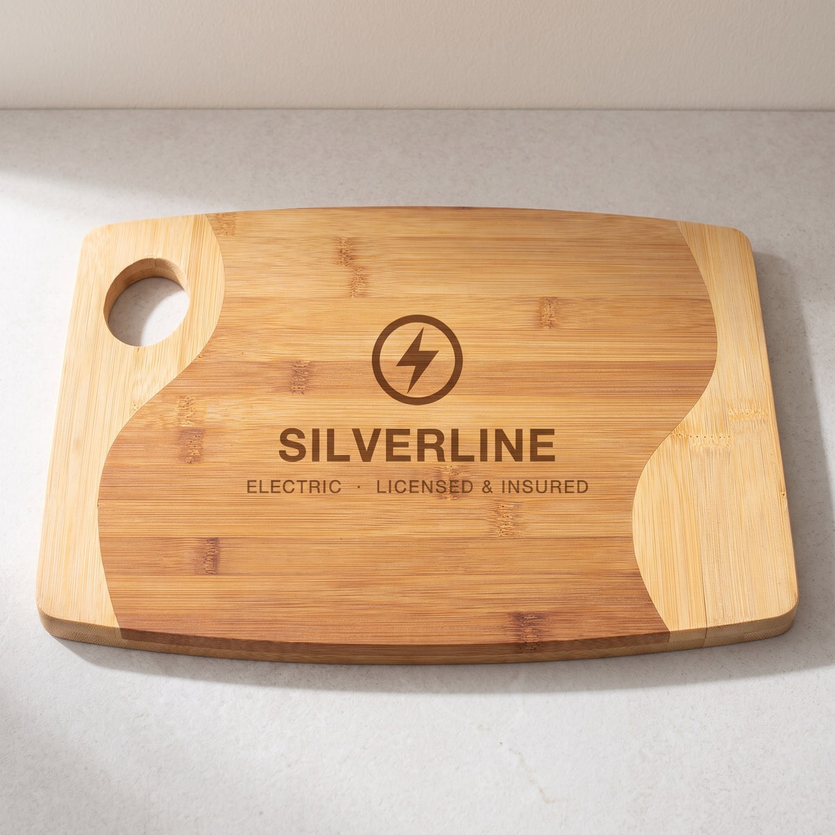 Custom Logo Two-Tone Bamboo Cutting Boards with Handle – 13¾" x 11" with sample engraved logo