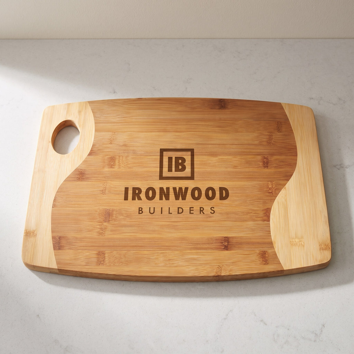 Custom Logo Two-Tone Bamboo Cutting Boards with Handle – 17¾" x 11¾" with sample engraved logo