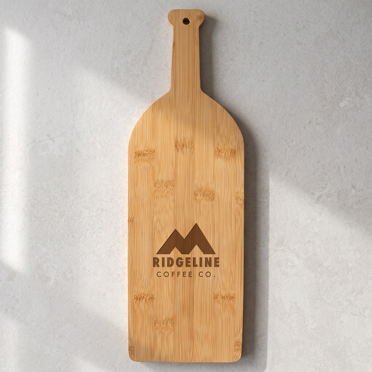 Custom Logo Bamboo Wine Bottle Cutting Board with sample engraved logo