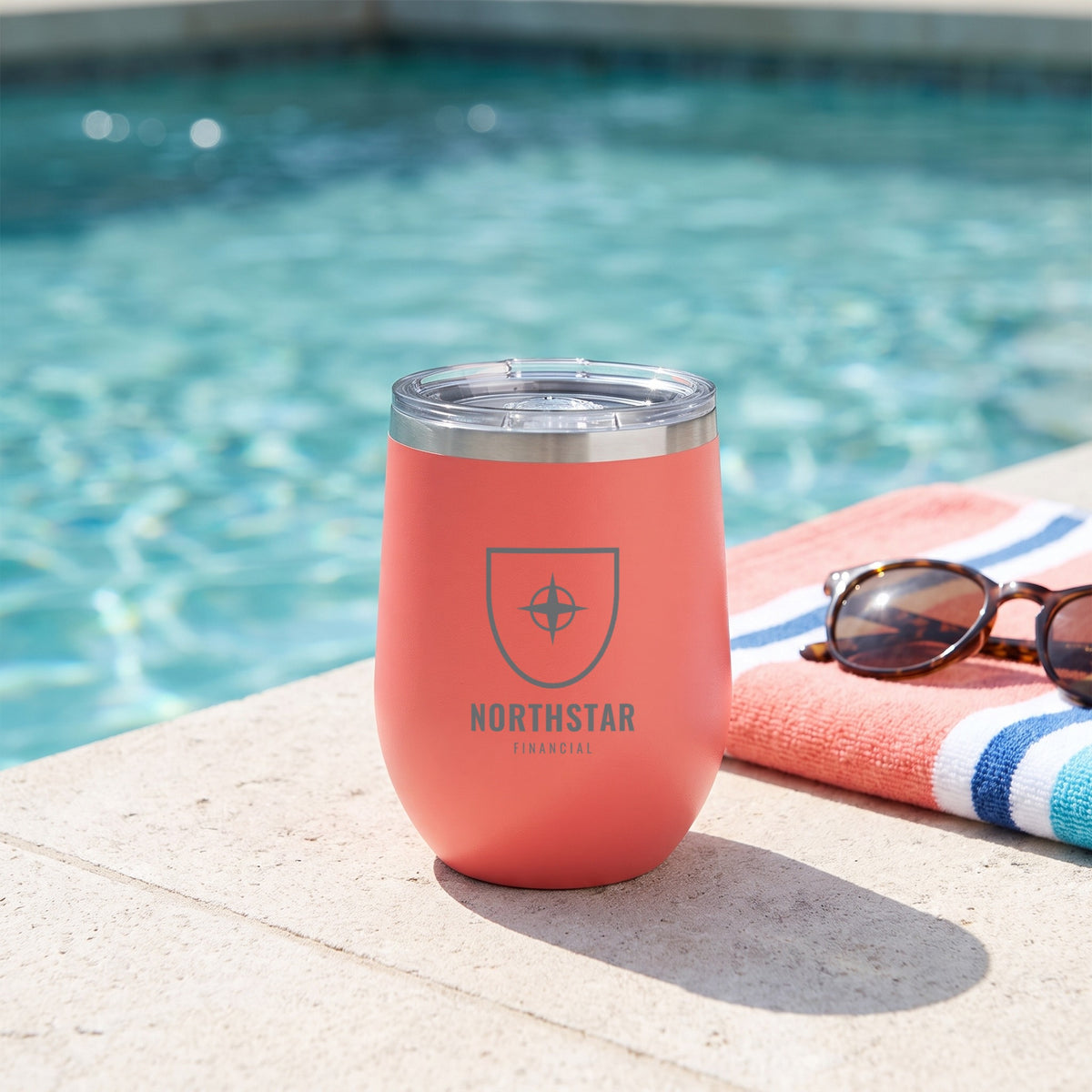 Custom Logo Polar Camel 12 oz Stemless Wine Tumbler, coral with an engraved sample logo by a pool