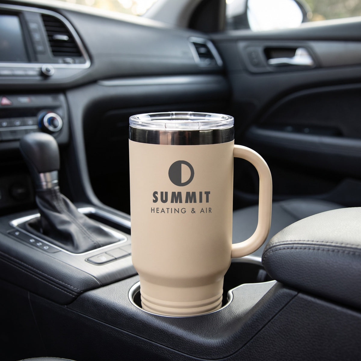 Custom Logo Polar Camel 40 oz Travel Mug – Warm Sand/Ghost Black in a car cup holder, engraved sample logo