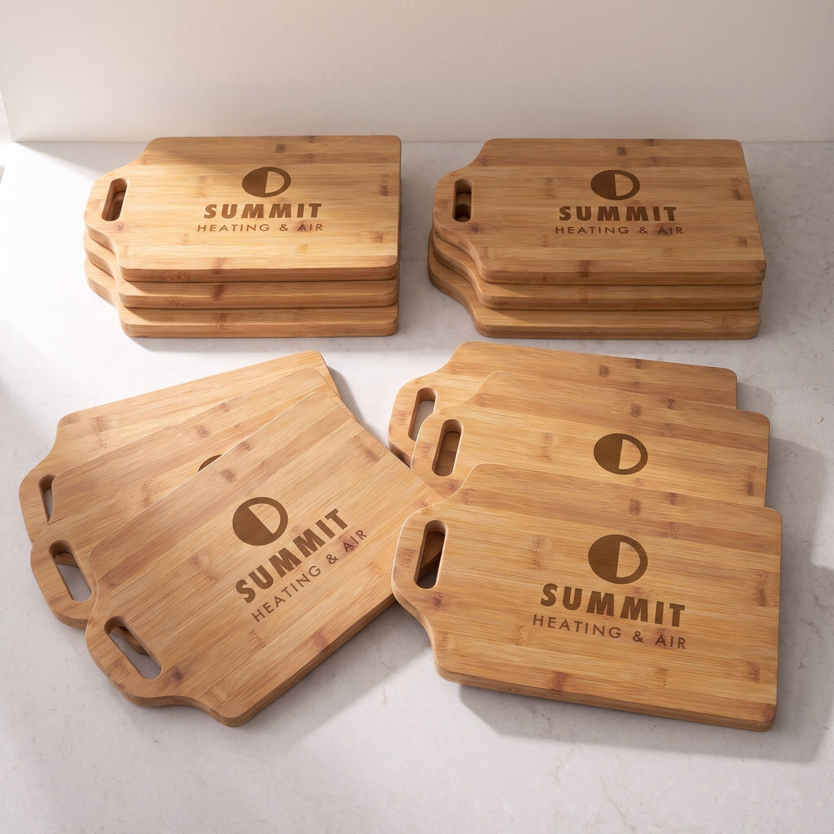 Custom Logo Bamboo Cutting Boards with Handle – bulk order of bamboo cutting boards with handle, all engraved with the same sample logo