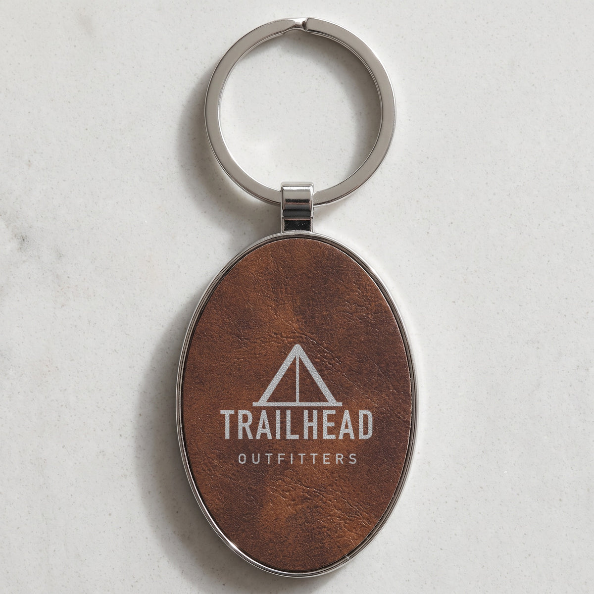 Custom Logo Leatherette & Metal Keychain – Oval, Rustic/Silver with an engraved sample logo