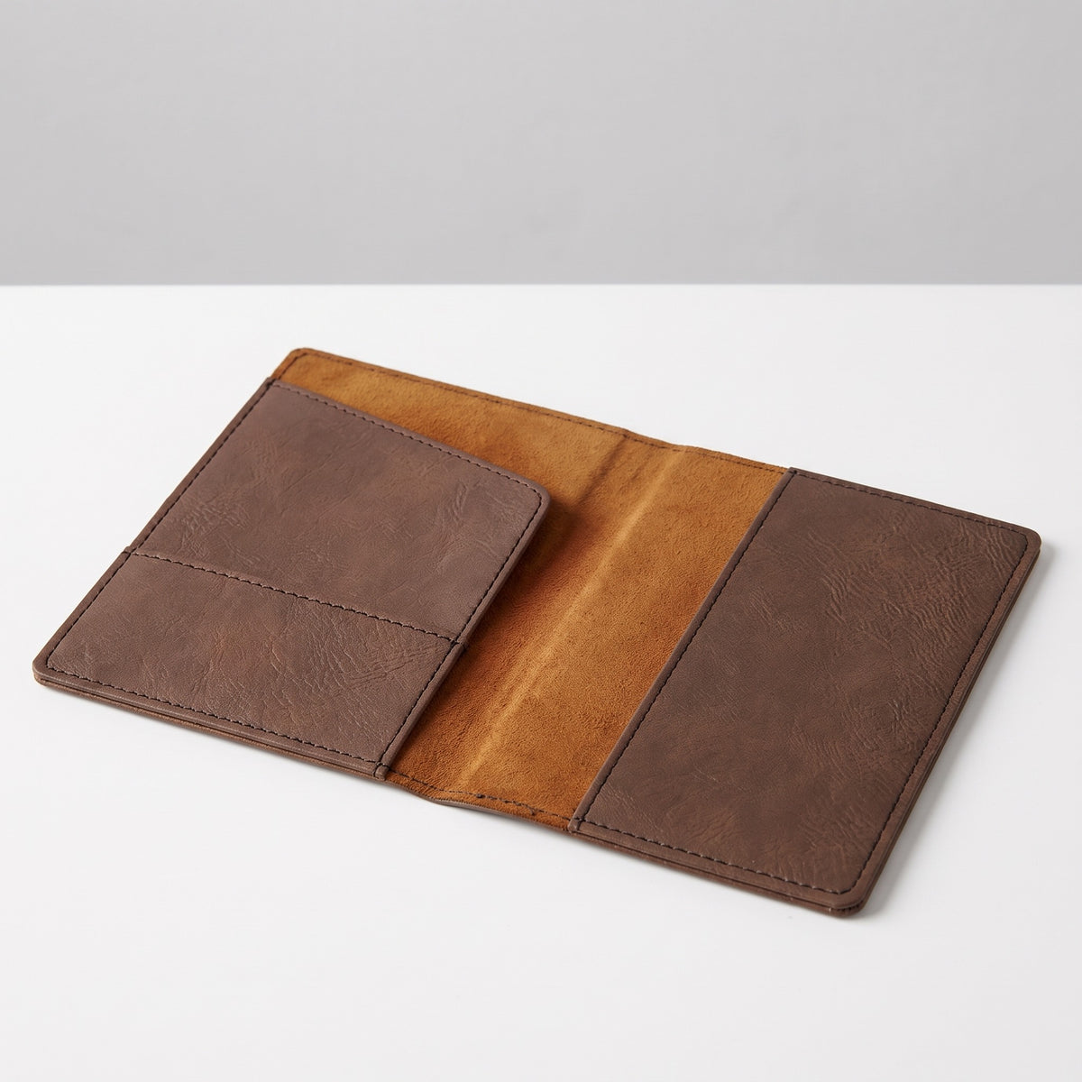 Custom Logo Leatherette Passport Holder, dark brown, lying open to show the inside: card slot on the left, passport pocket on the right