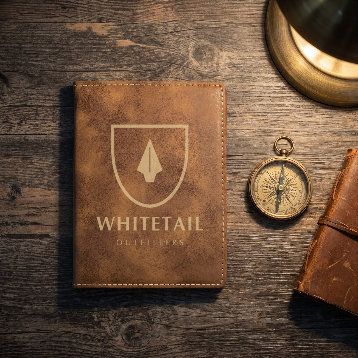 Custom Logo Leatherette Passport Holder, rustic/gold with a gold engraved sample logo beside a compass