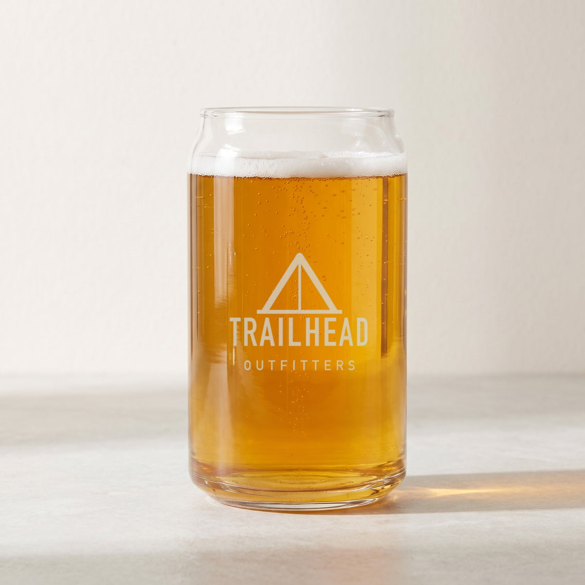 Custom Logo Libbey Beer Can Glass, 16 oz filled with beer, etched with a sample logo