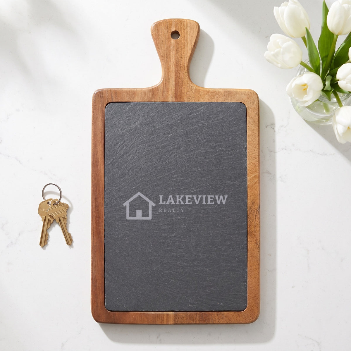 Custom Logo Slate & Acacia Paddle Cutting Board, 13 1/4 x 7 inch board with an engraved sample realty logo as a closing gift